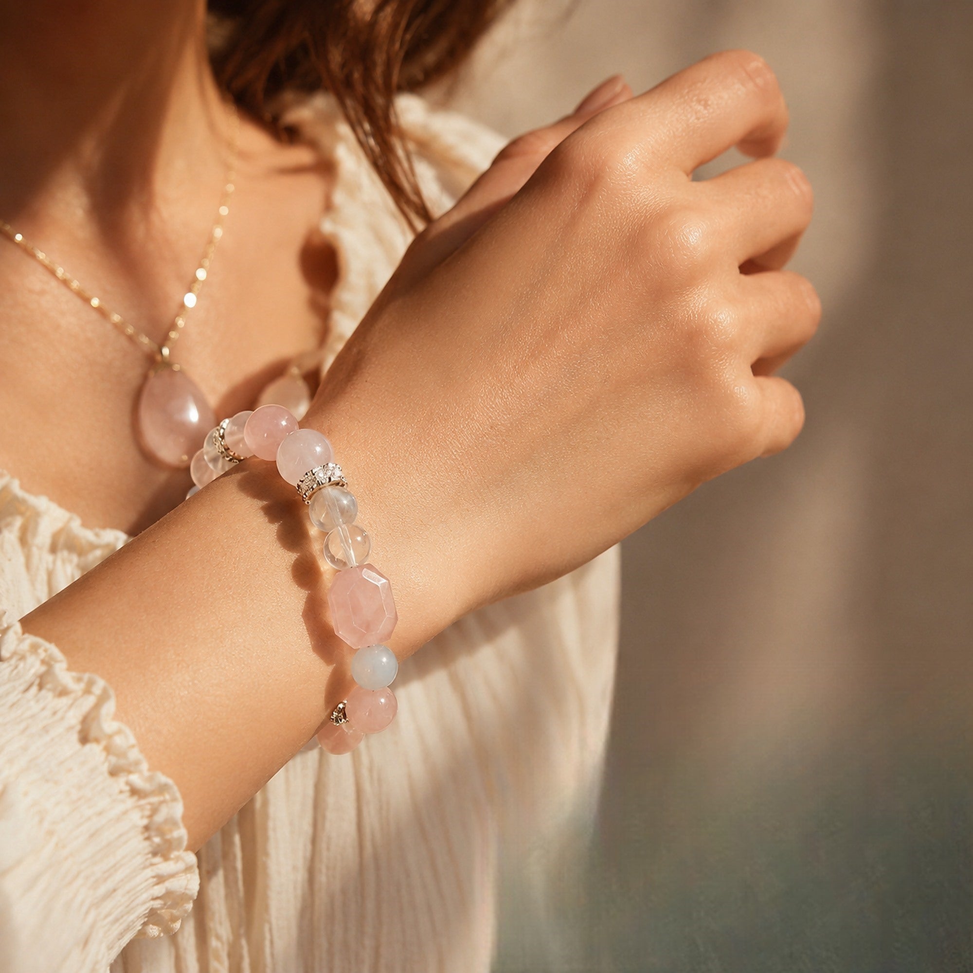 Rose quartz aquamarine bracelet worn close up
